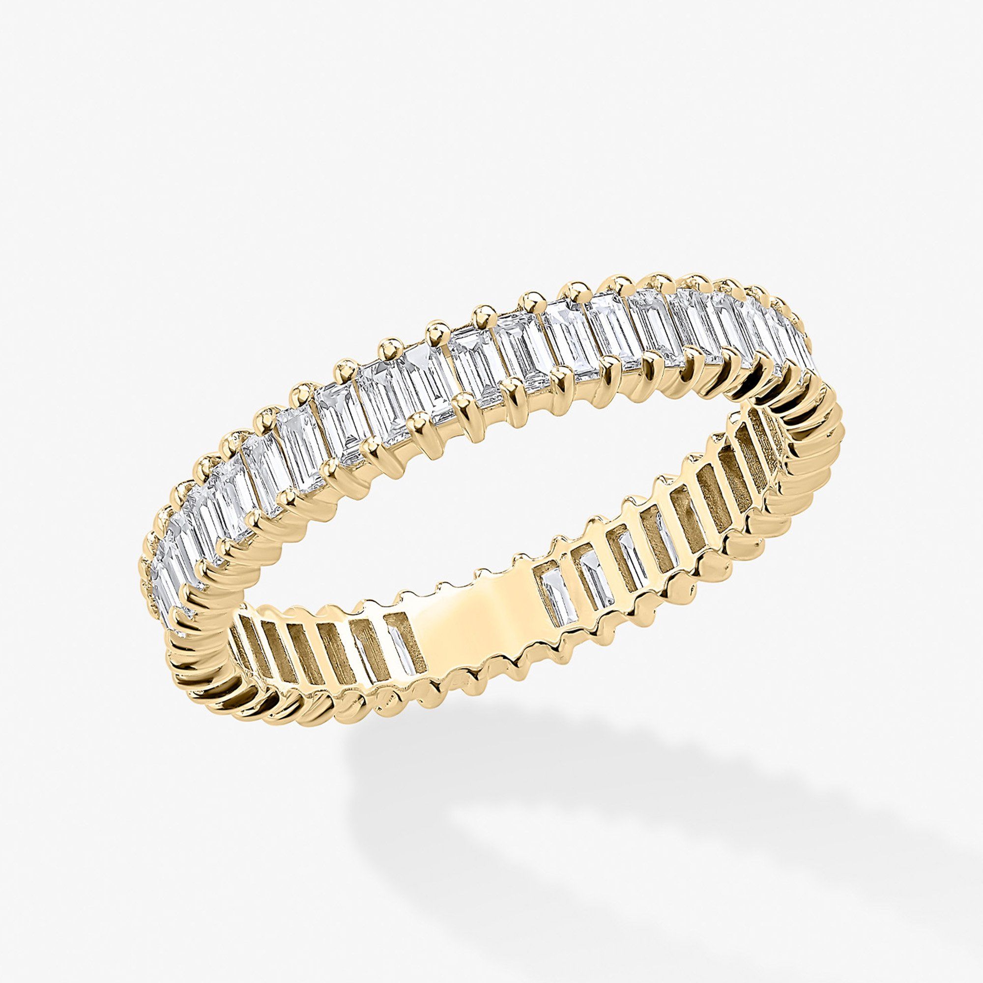 Gold ring with alternating baguette and round cut diamonds.