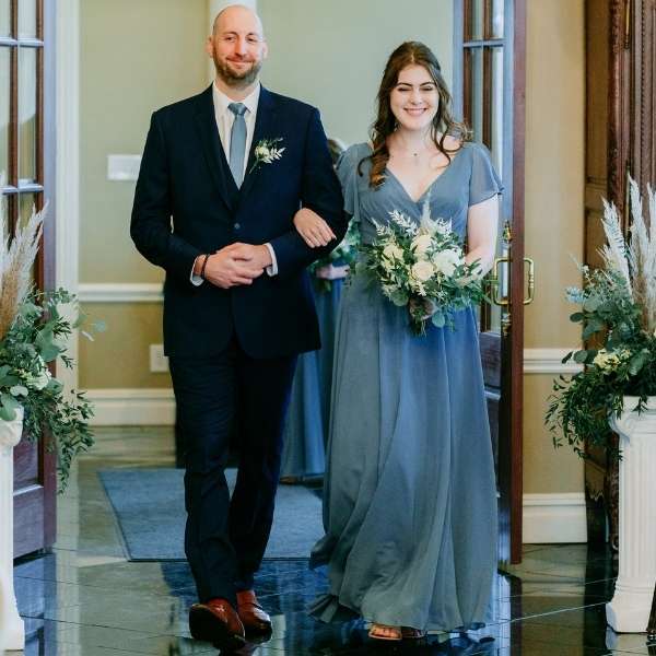 Groomsmen wearing a serene necktie with a navy blue suit