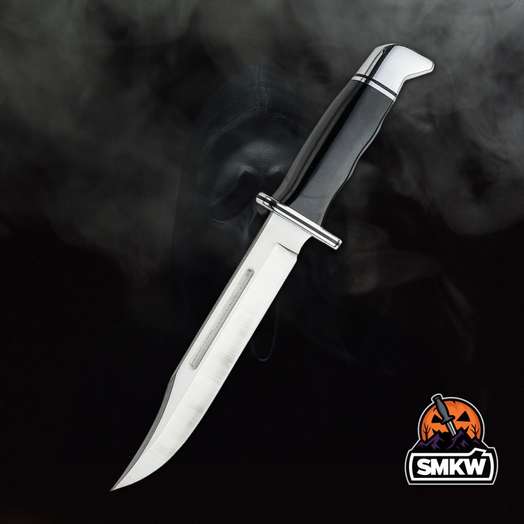 A knife with a black handle against a smoky background.