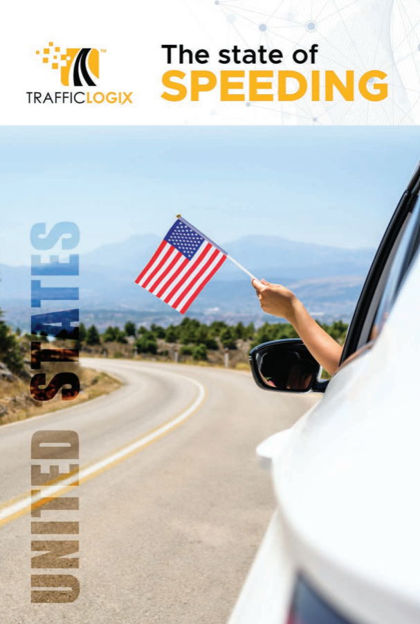 A hand holding an American flag out of a car window.