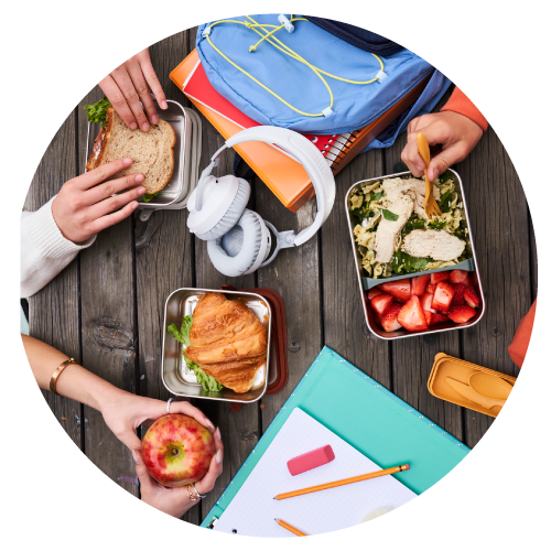 Food and lunch boxes on table