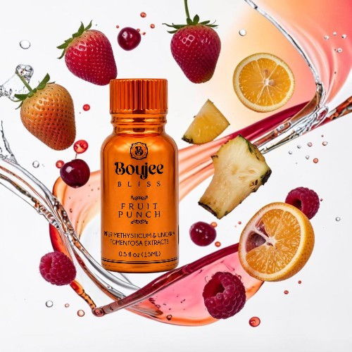 Bottle of fruit punch surrounded by fresh fruits and splashes of liquid.