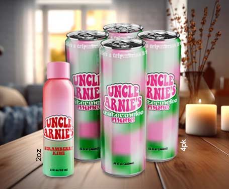 Cans of Uncle Arnie's drink on a table with candles.