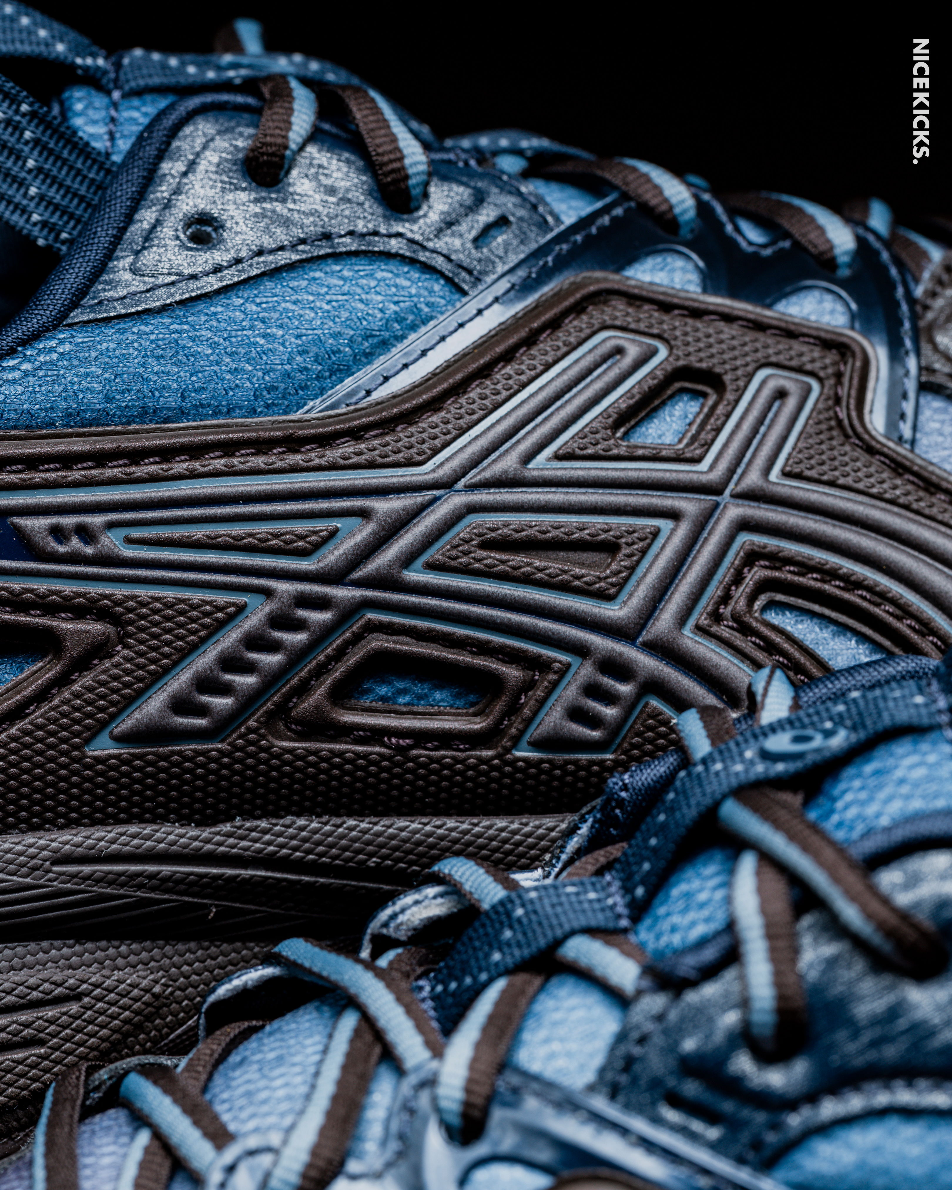 Close-up of blue and brown athletic shoes.