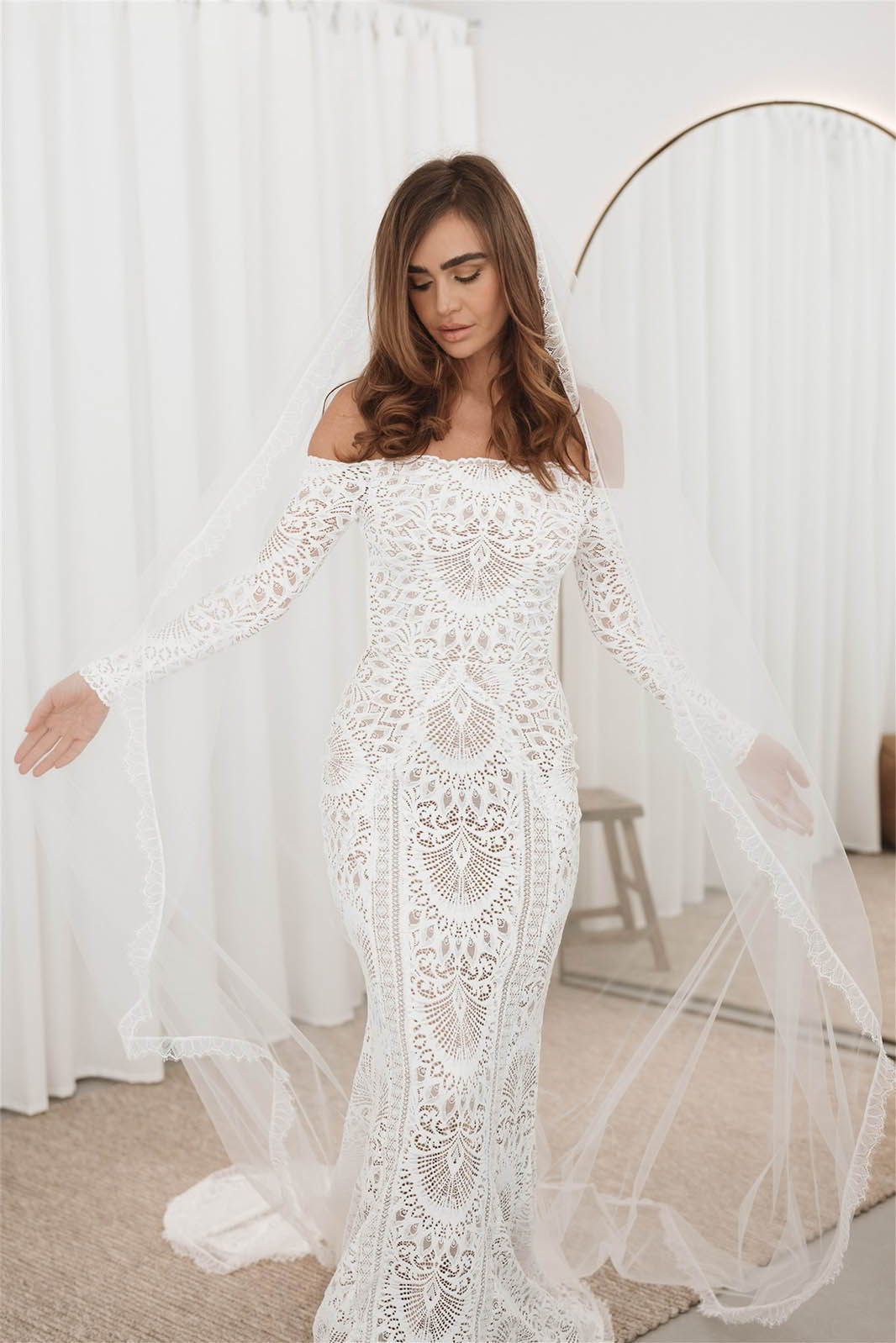 Bride wearing the long sleeve Nathalia gown