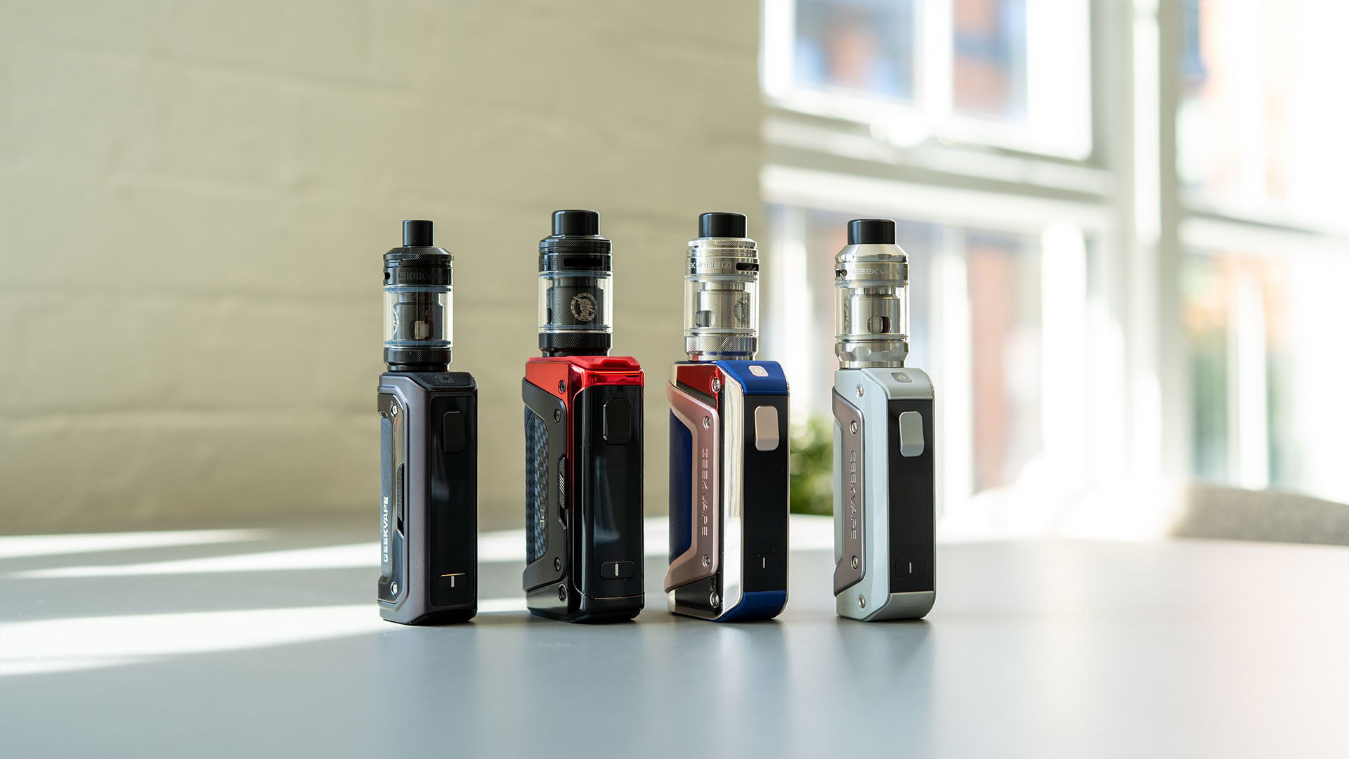 A picture of Geek Vape Sub-ohm kits lined up on a table