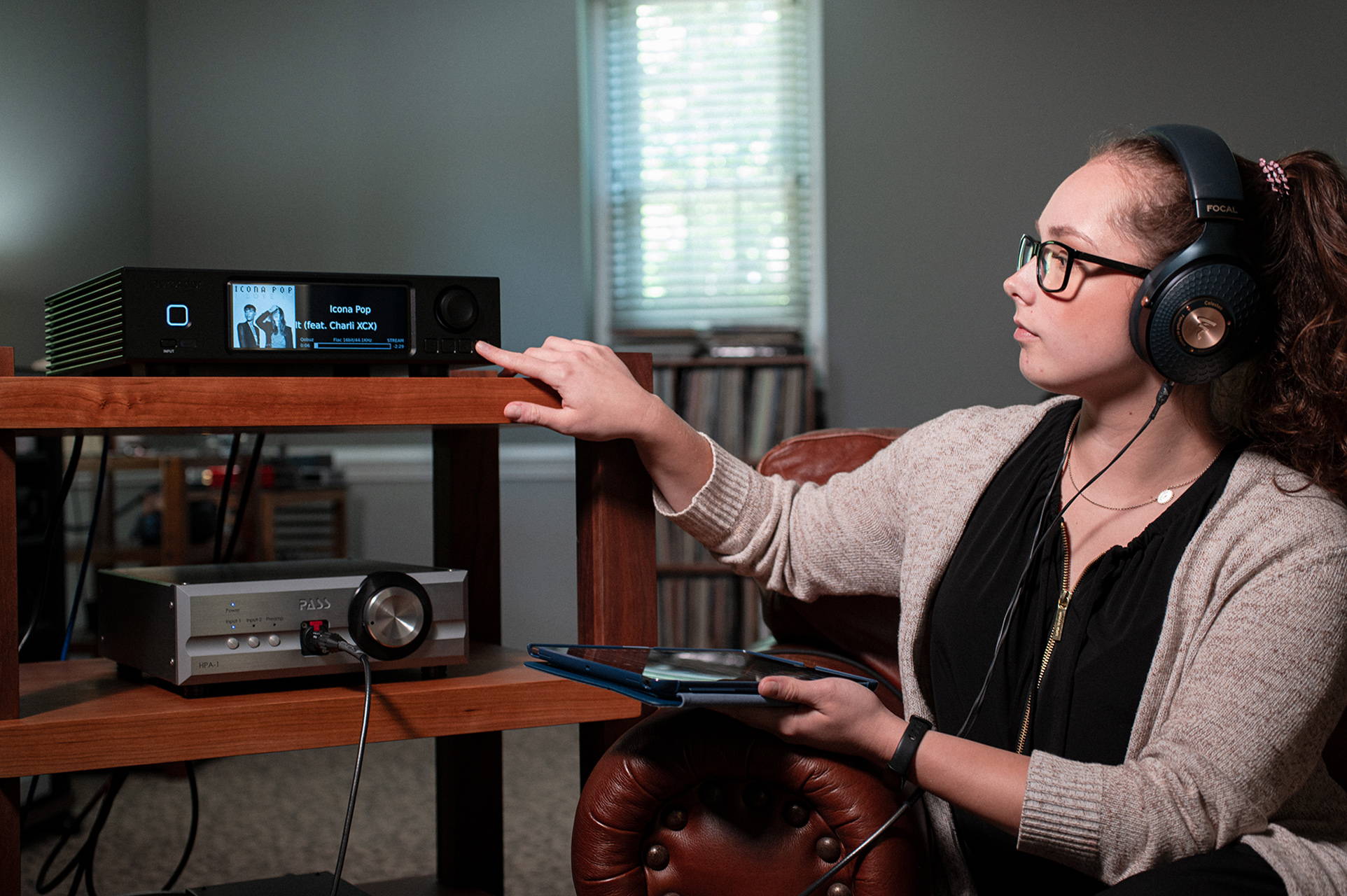 Individual listening to music on the Aurender A200 Music Streamer with Focal Celestee headphones