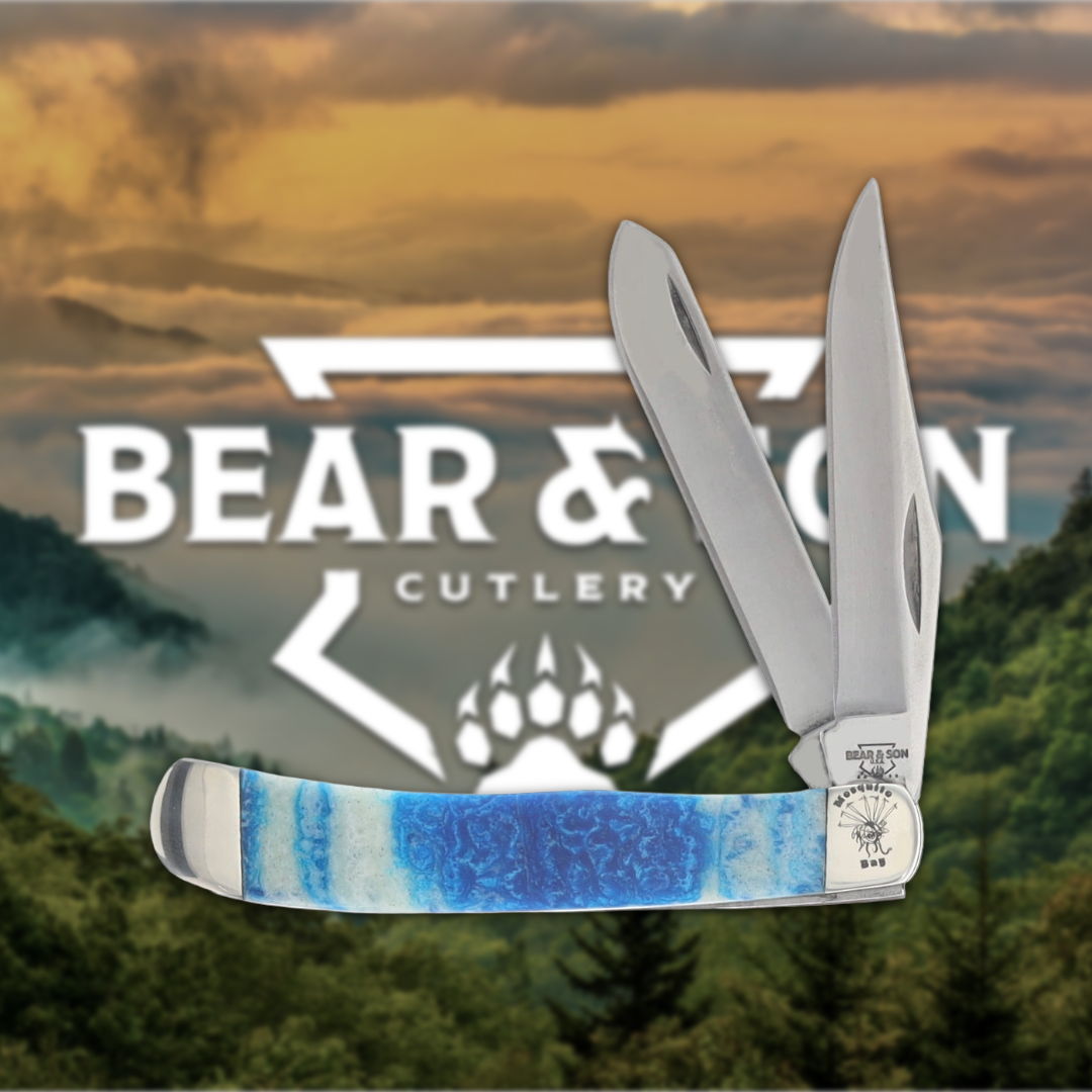 Knife with blue handle in front of Bear & Son Cutlery logo.