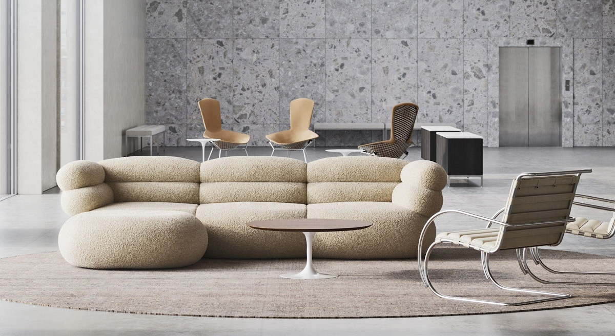 Modern living room with a Knoll curved sofa, coffee table, and stylish chairs.