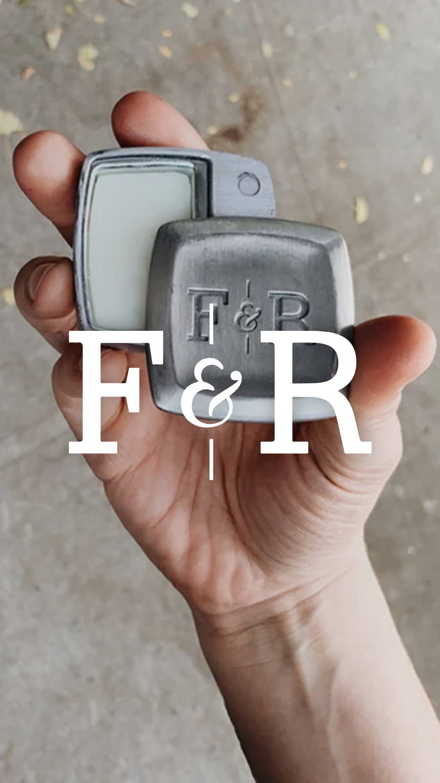 Hands holding a Fulton & Roark cologne container