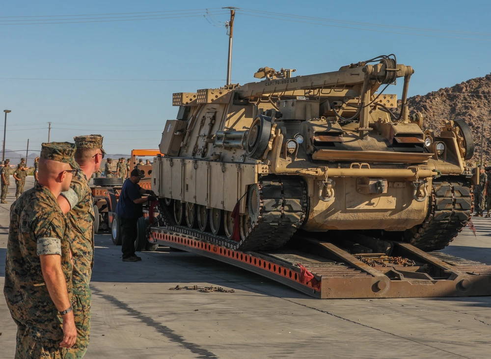 U.S. Marines with 1st Tank Battalion watches as one of the last Hercules M88 recovery vehicles are loaded up on a tow truck at Twentynine Palms, Calif. on July 28, 2020. As a part of Force Design 2030, the Hercules M88 recovery vehicles are being divested from the Marine Corps in an effort to accelerate modernization and realign capabilities, units and personnel to higher priority areas. (U.S. Marine Corps Lance Cpl. Justin Evans)