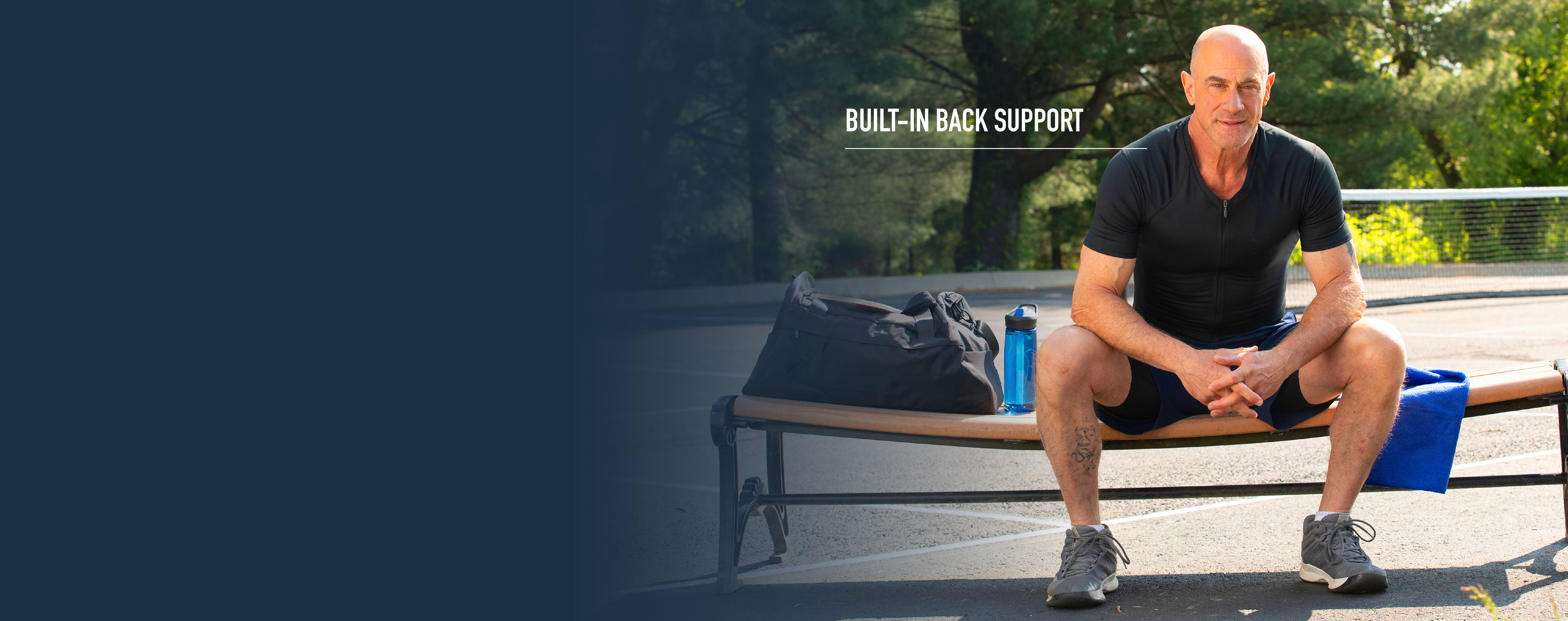 Christopher Meloni wearing the Full Back Support Shirt.