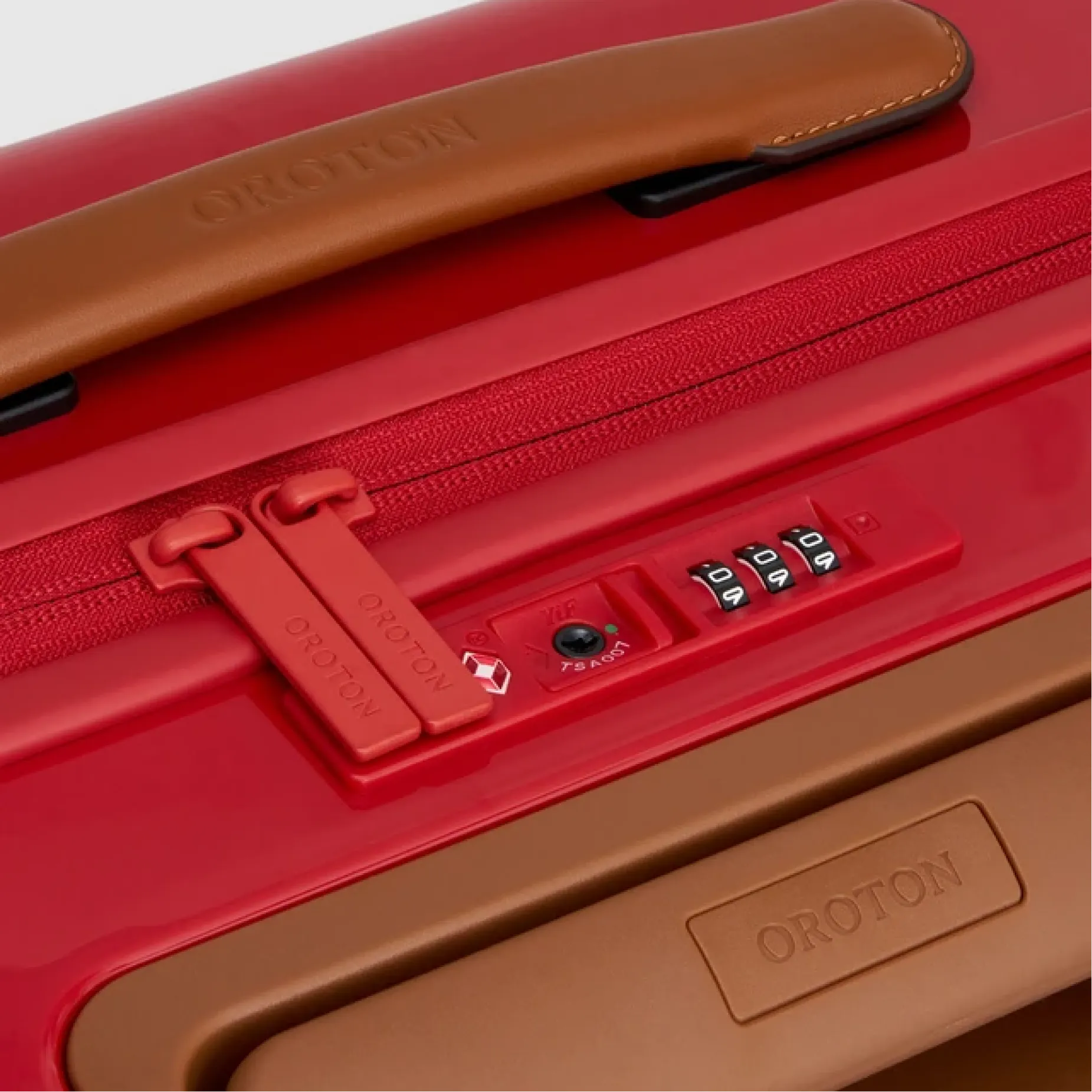Red suitcase with a brown handle and combination lock.
