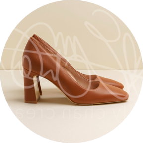 Brown high-heeled shoes displayed against a light background.