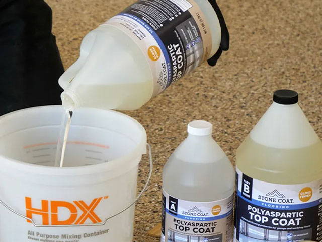 Preparing the area for Polyaspartic Topcoat application, measuring the required amount, and mixing with optional non-skid additive for desired texture