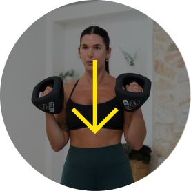 Person exercising with YBells in a fitness environment.