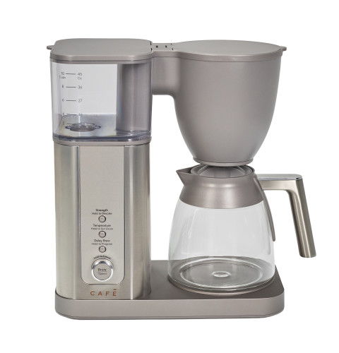 Coffee maker with glass carafe and water reservoir.