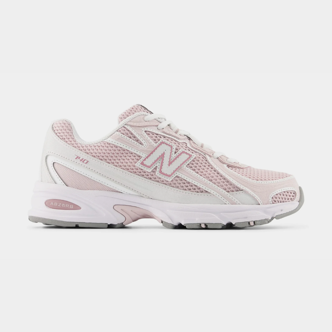 Light pink New Balance sneakers with mesh design and white accents.