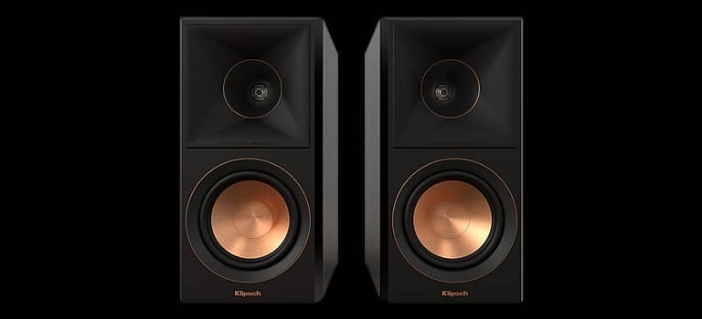 Two black speakers with copper woofers and a modern design.