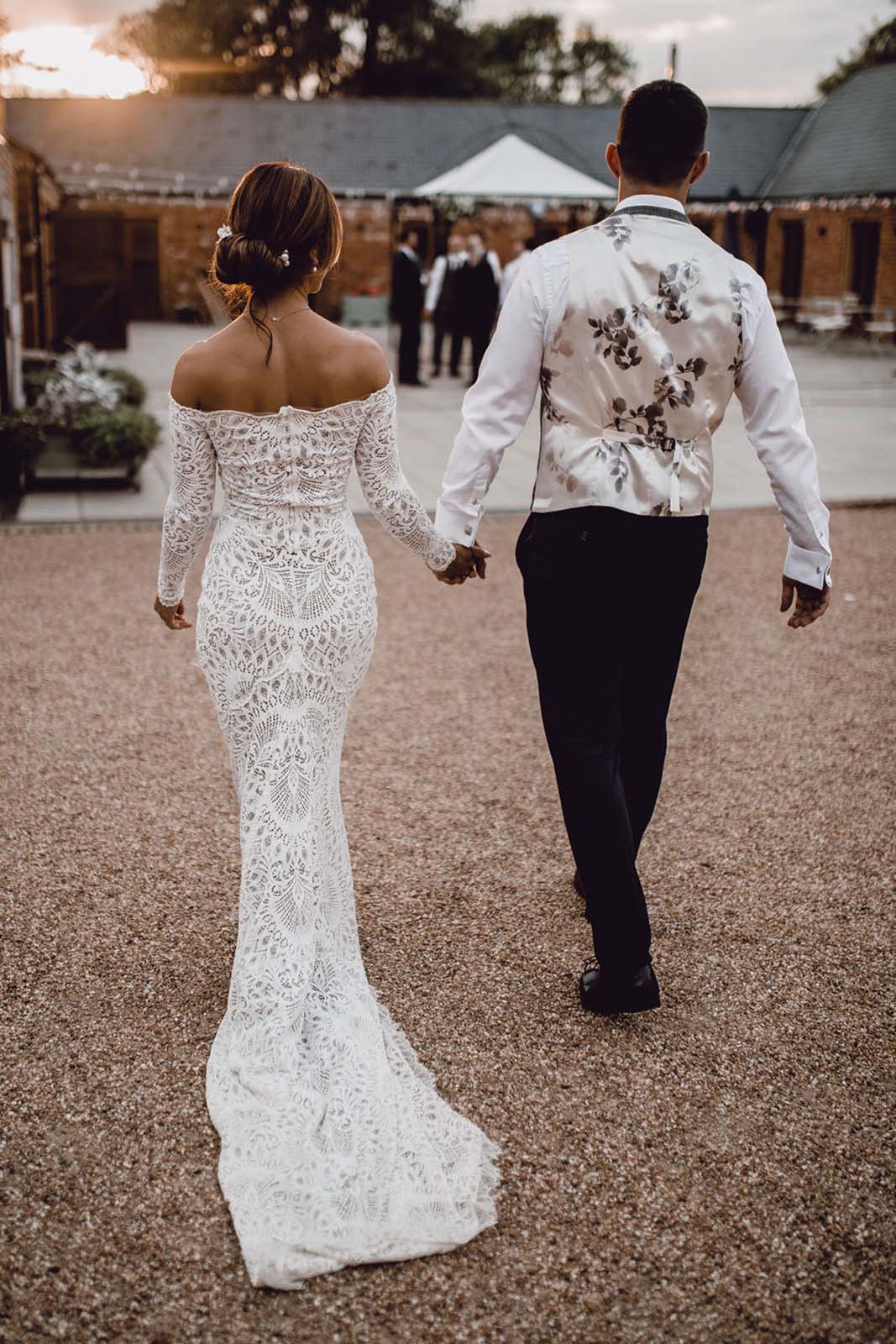 Bride and groom, holding each other's hand