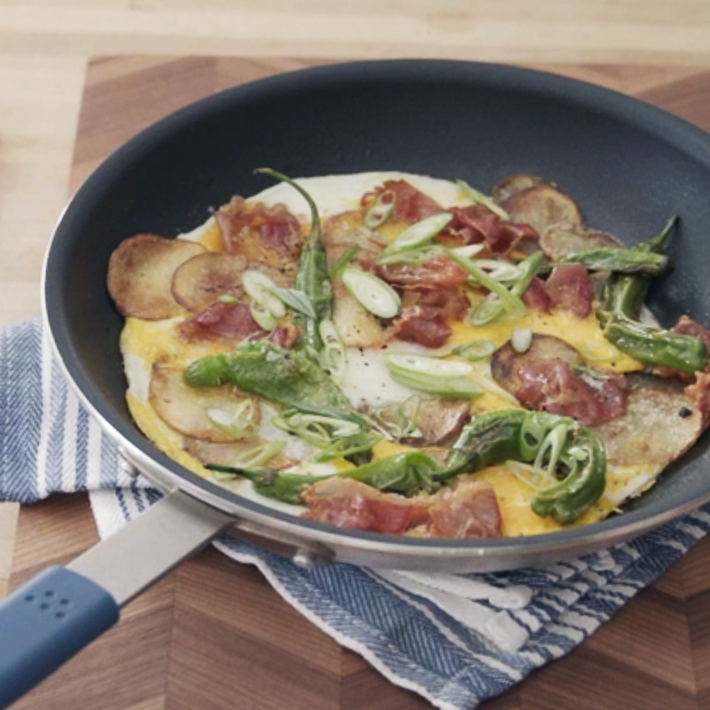 You can comfortably stir and spread omelette ingredients within the Misen Nonstick Pan, ensuring an even cook-through.