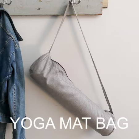 A bag to store and carry a yoga mat hanging in the hall way