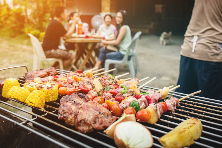 skewers of meat and vegetables on open grill