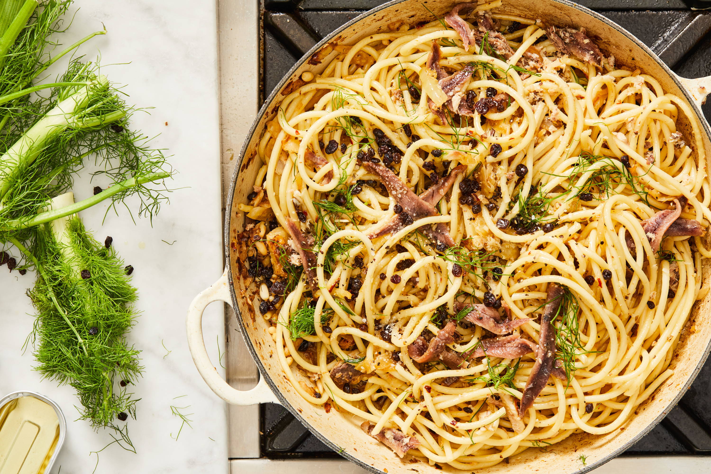 Pasta in a pot with sardines, anchovies and fennel.