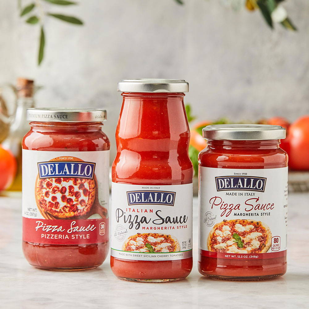 Assorted DeLallo Pizza Sauces on a marble table