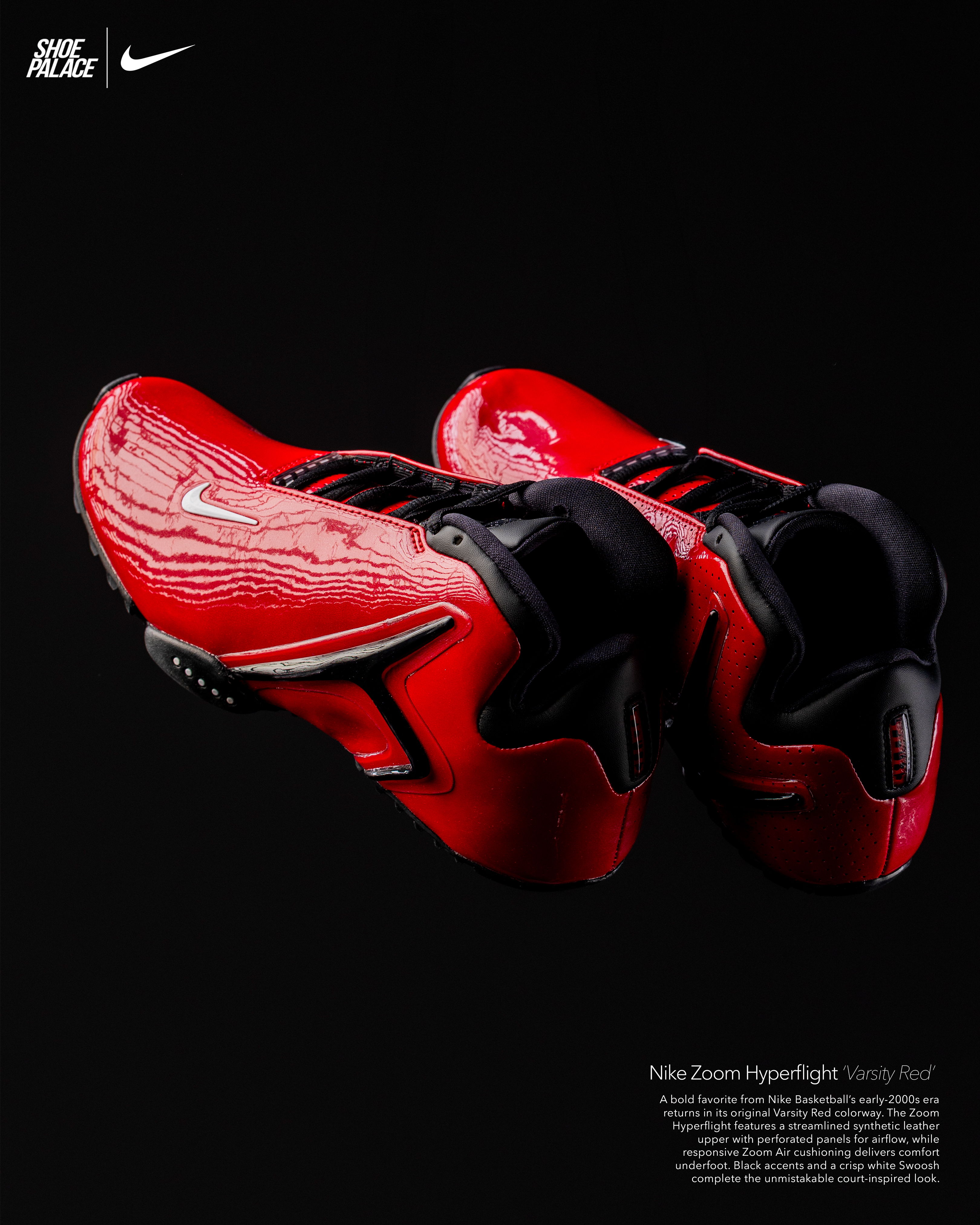 Red Nike shoes on a black background.