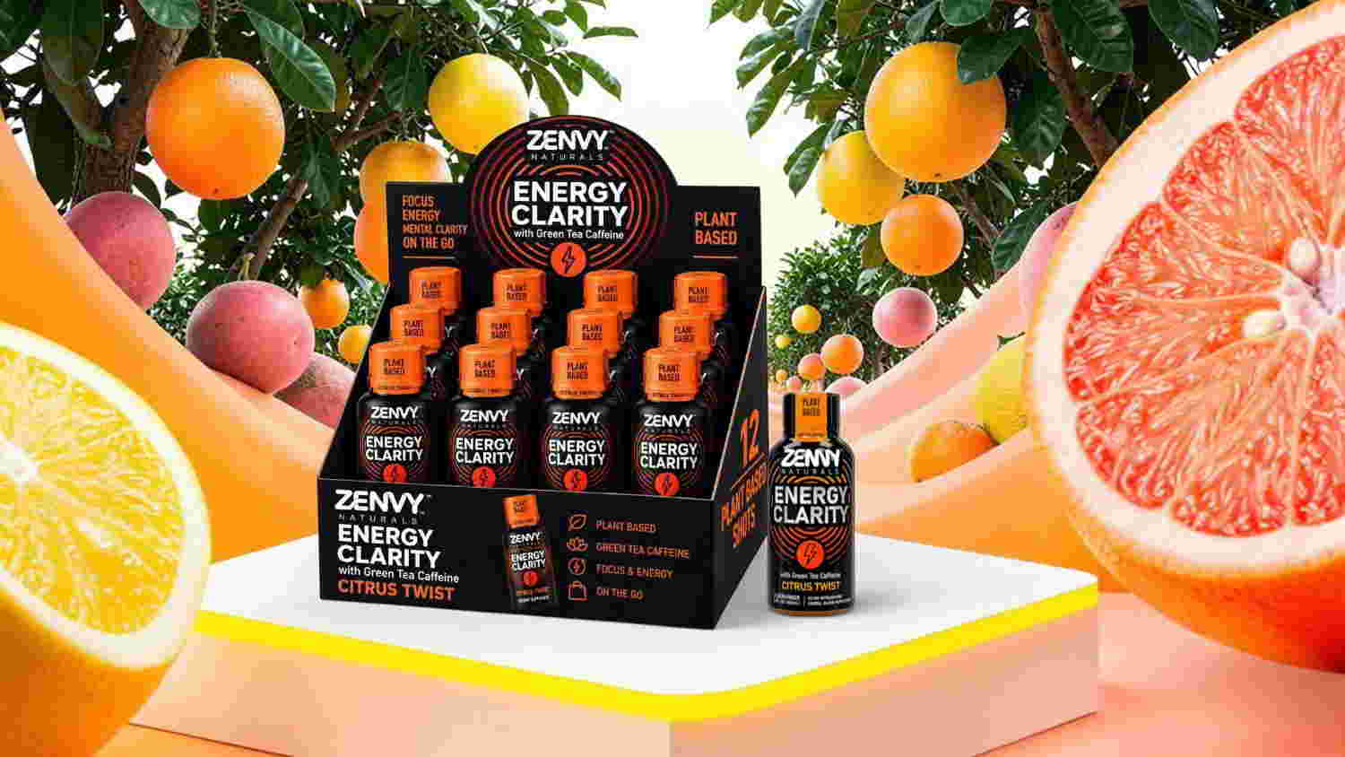 Product display of energy shots surrounded by citrus fruits.