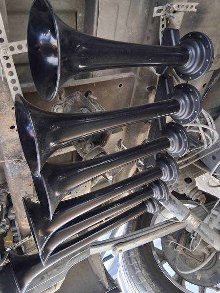 Shocker S6 horns mounted under a 2016 Chevy Silverado 1500