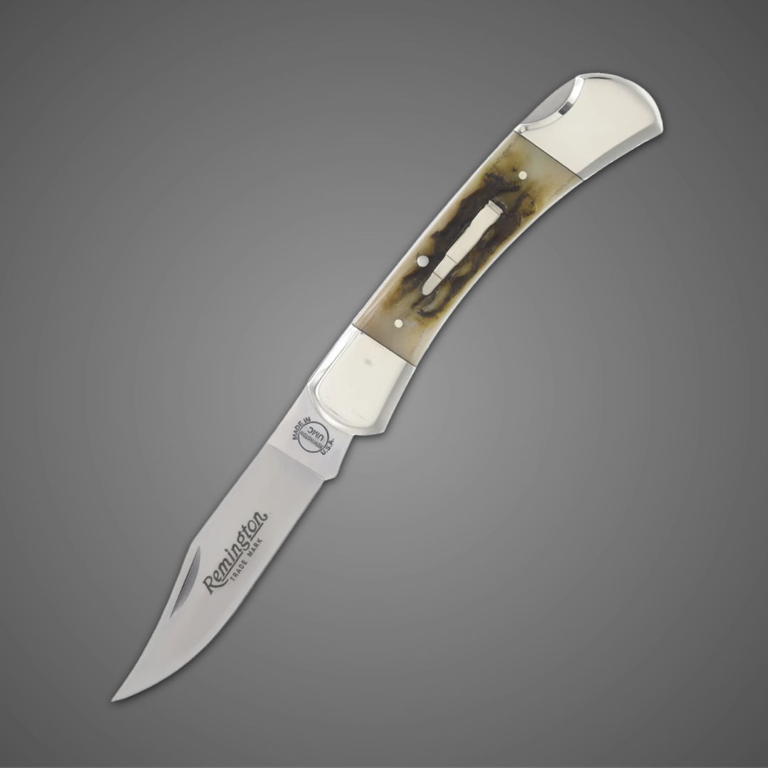 A folding knife with a silver blade and decorative handle.