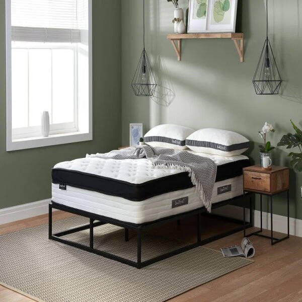 sleepsoul mattress on black frame with pillows 