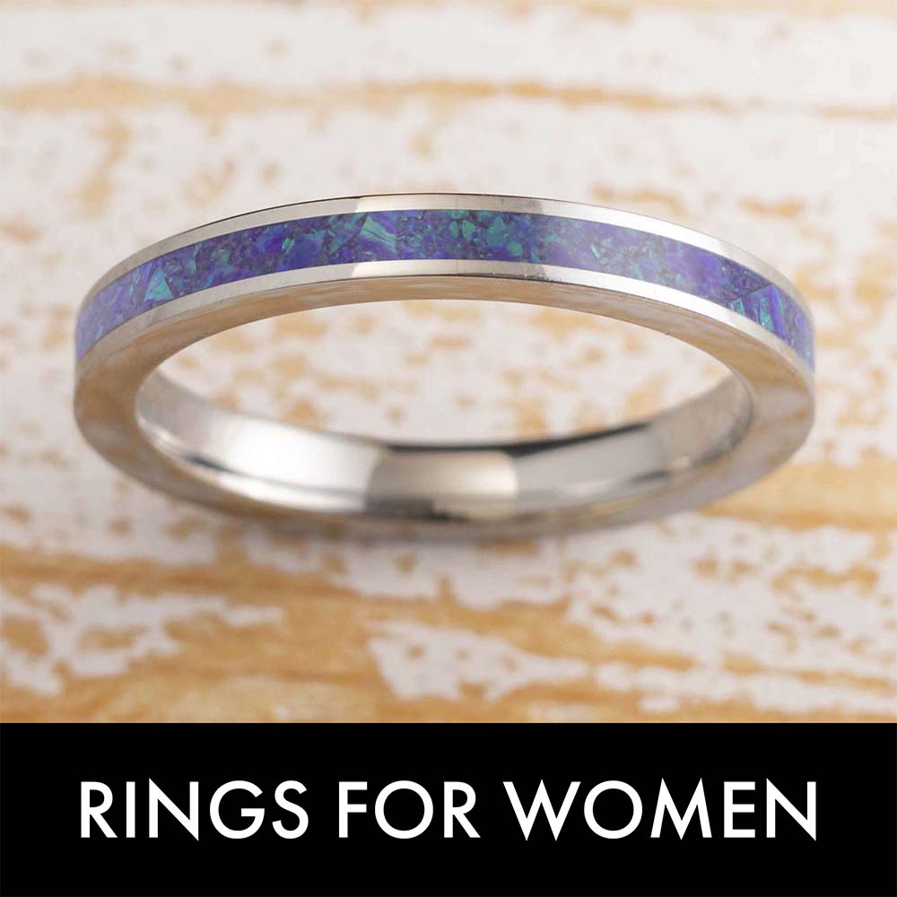 Silver ring with purple inlay, labeled 