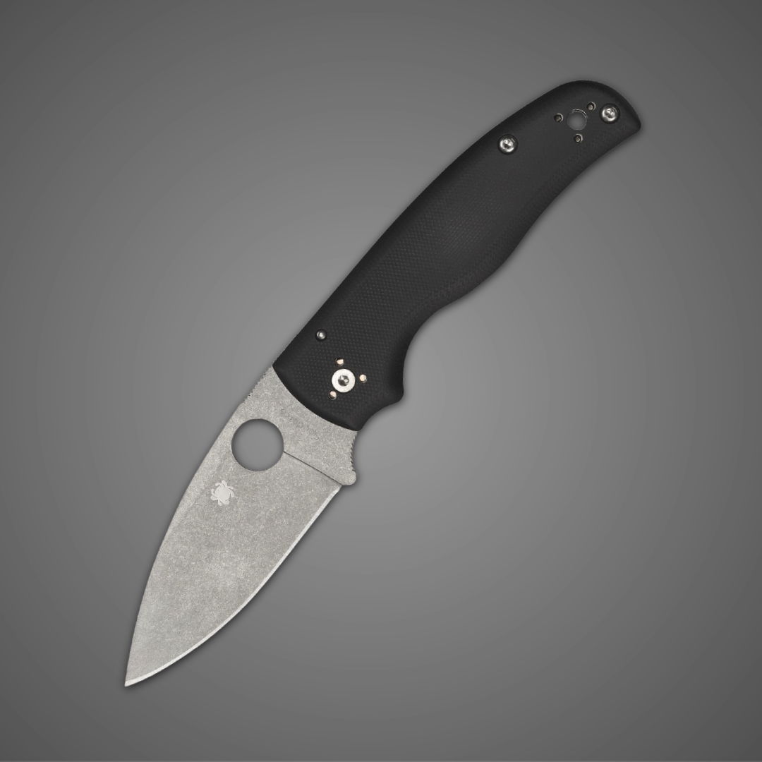 A folding knife with a black handle and stainless steel blade.