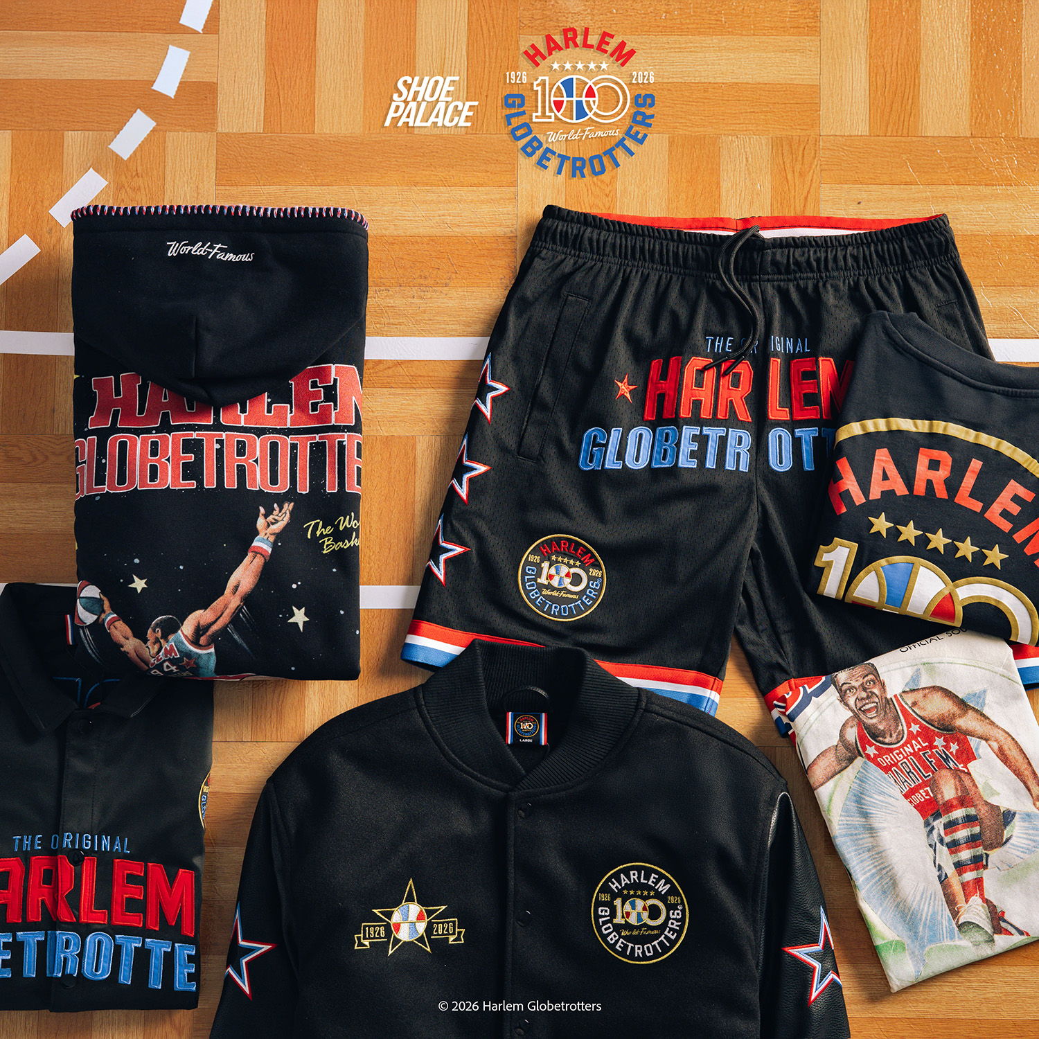 Harlem Globetrotters apparel including shirts, shorts, and jackets on a basketball court.