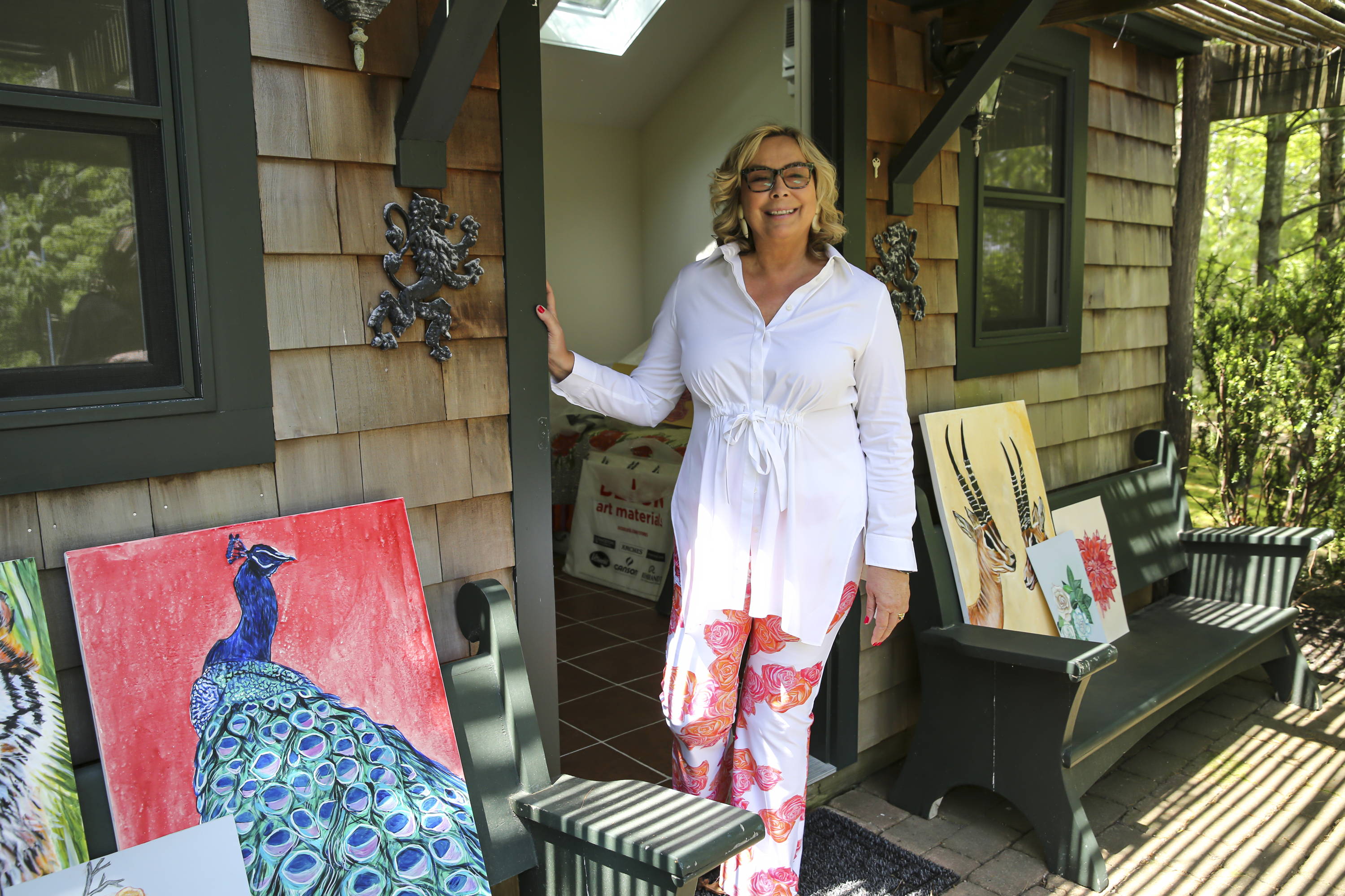 Ala Isham at her home in Long Island wearing floral printed stretch knit pants by Ala von Auersperg