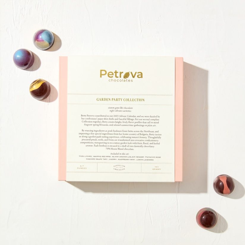 A product box with colorful marbles around it.