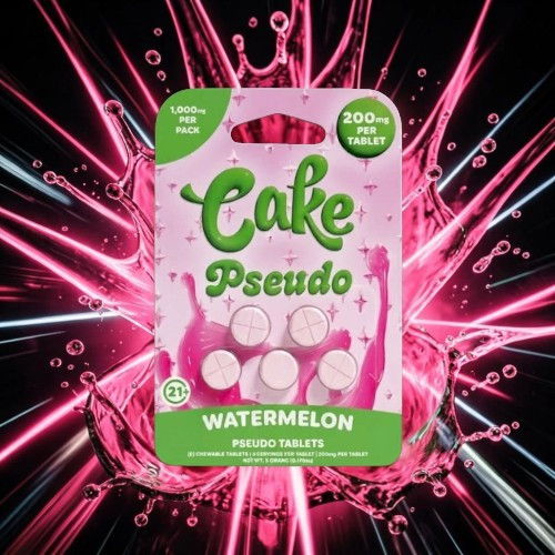 Pink package of Cake Pseudo watermelon tablets with a vibrant splash background.