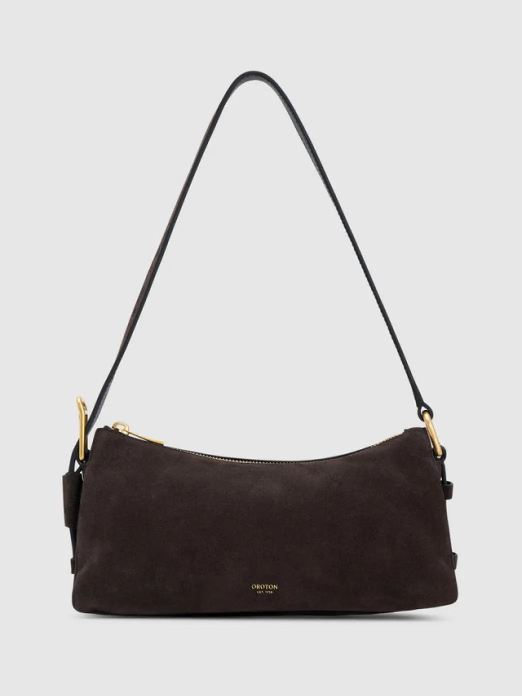 A dark suede handbag with a single shoulder strap.