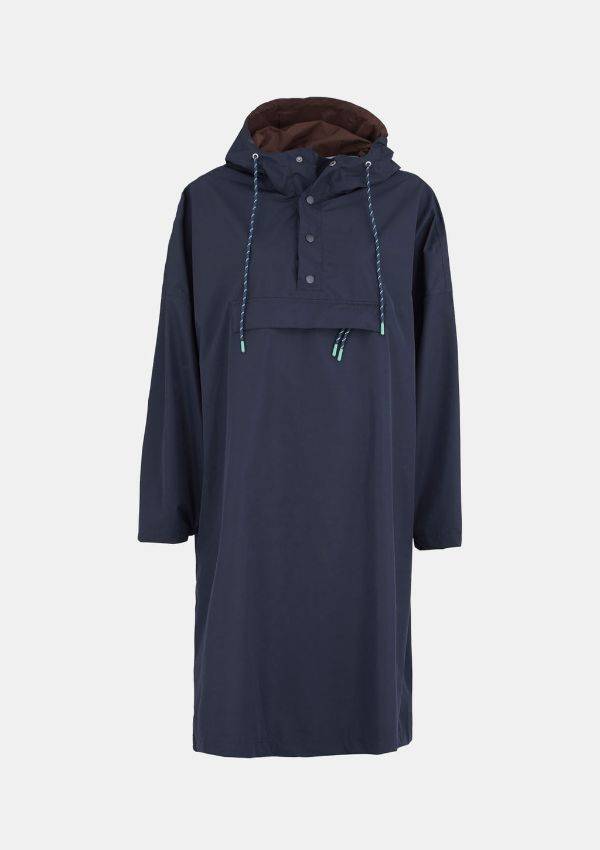 Product image of Becksondergaard Solid Rain Poncho in Navy Blue. Three quarter length raincoat, drawstring adjustable hood, quarter length opening at the neck with three poppers and kangaroo front pocket.