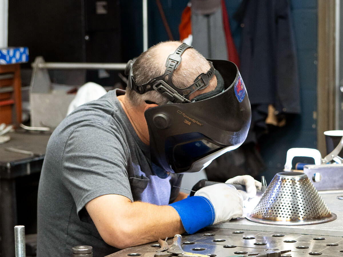 Cut2Size Metals employee working on custom fabrication project