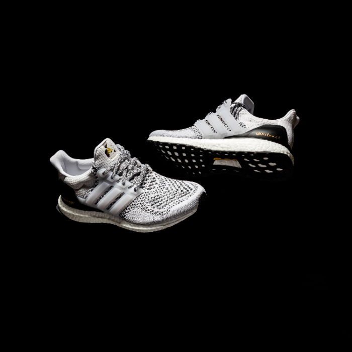 white/grey/black adidas ultraboost on black background