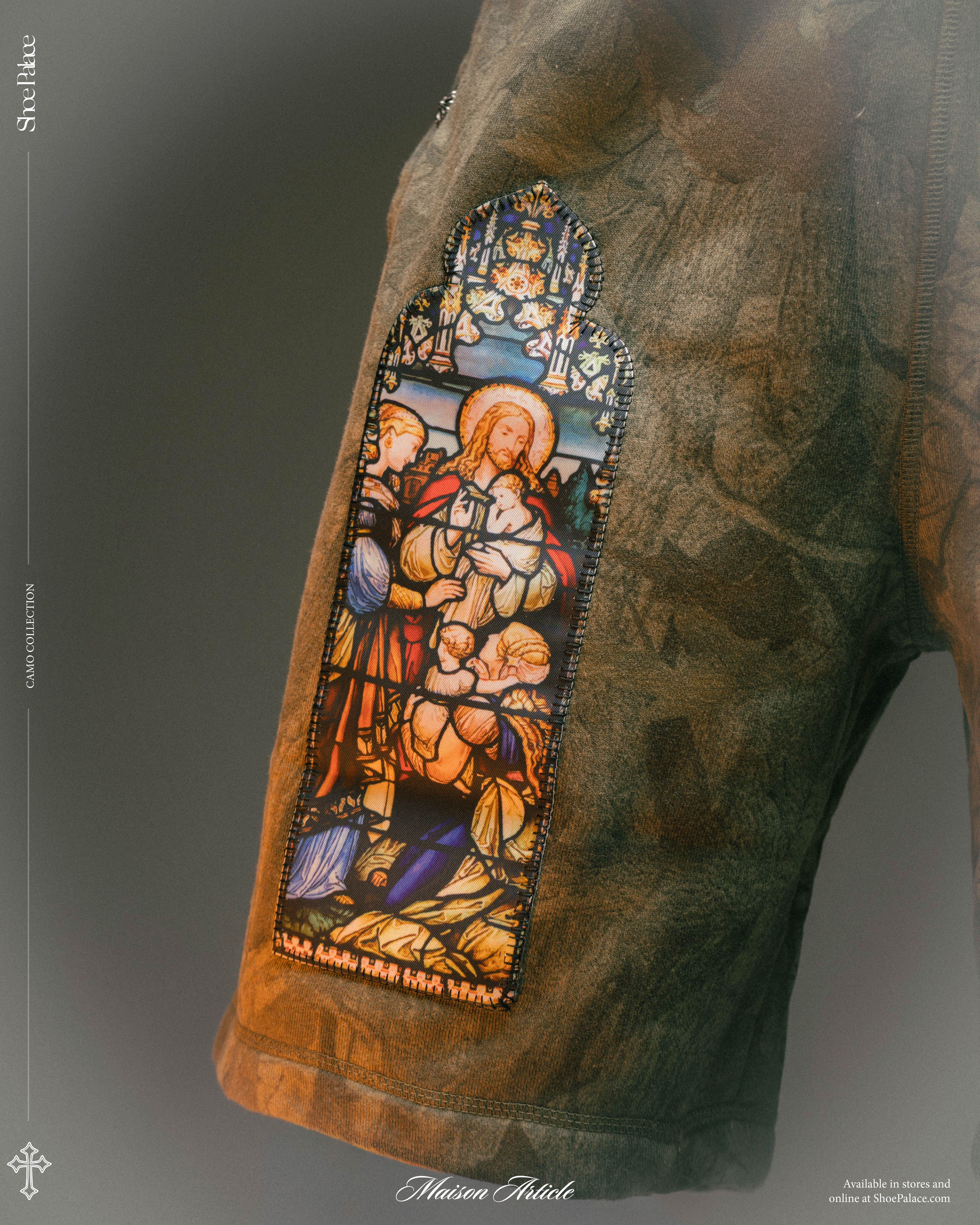 Stained glass artwork depicting biblical figures on a textured garment.