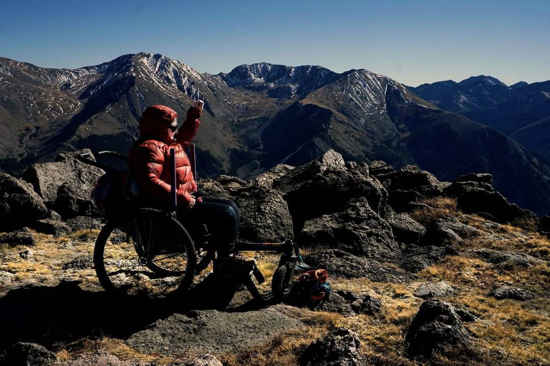 Melissa on rocky terrain using GRIT Freedom Chair hiking
