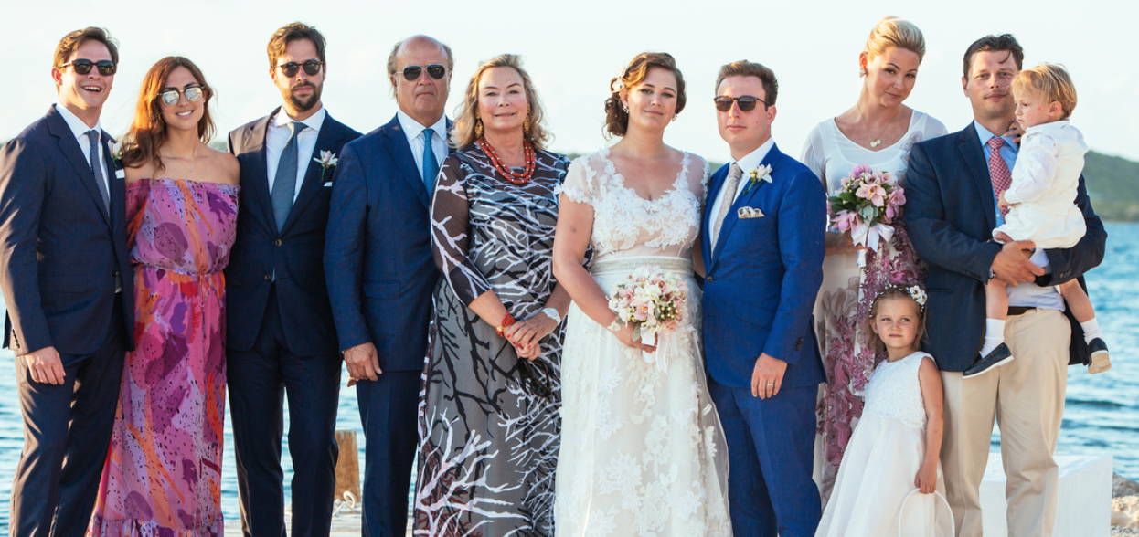 Bridal party wearing custom silk dresses by Ala von Auersperg at a destination beach wedding