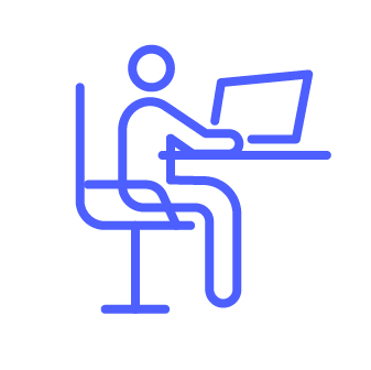 Man sits at a desk with laptop