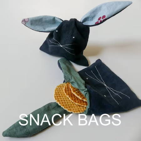 Two snack bags in the shape of a little bunny made out of cotton and vinyl fabrics