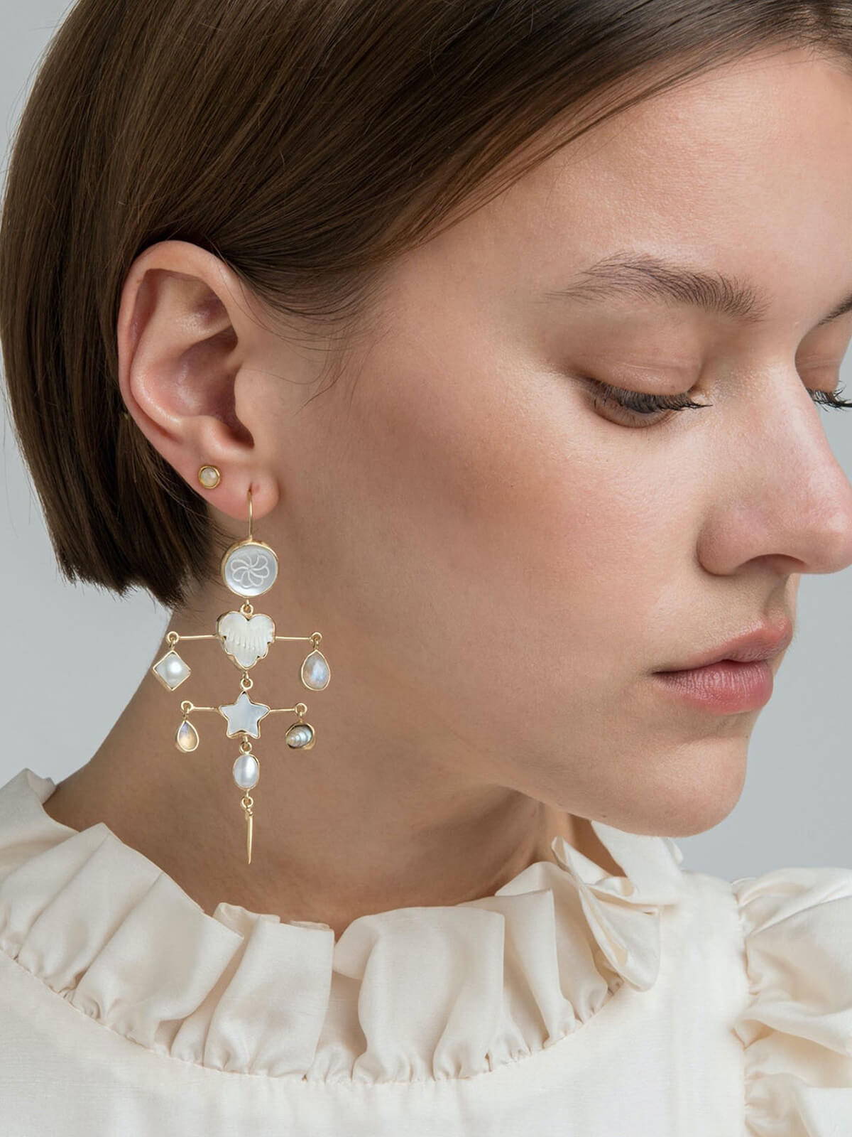 A model wearing the Grainne Morton Layered with Victorian Drop Pearl Earrings.